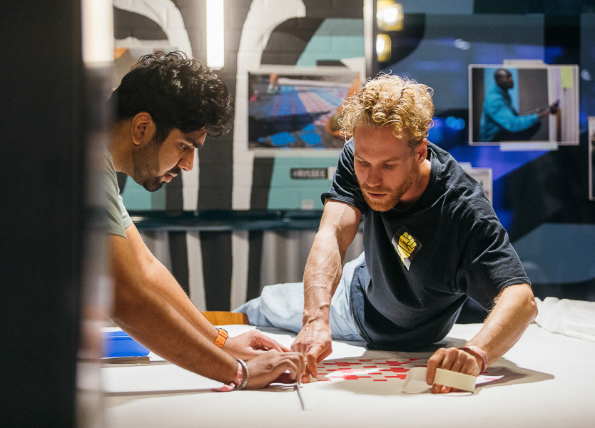 Two men work on a craft project during a workshop at The Student Hotel Rotterdam